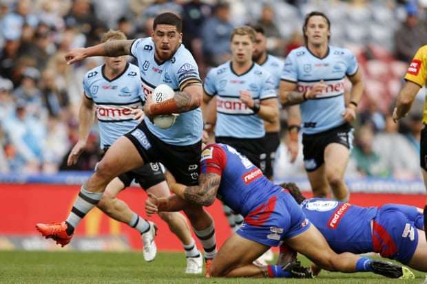 Braden Hamlin-Uele of the Sharks runs with the ball against Newcastle Knights at the weekend.