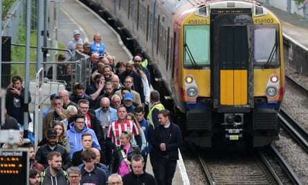 Brentford fans leave Kew Bridge railway station en route to their match against Tottenham last April.