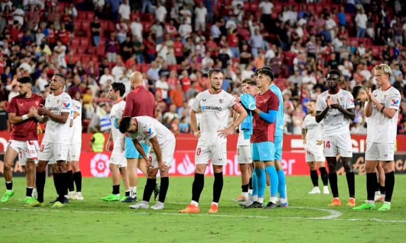Sevilla’s players after the game in which they started strongly but ultimately lost heavily.