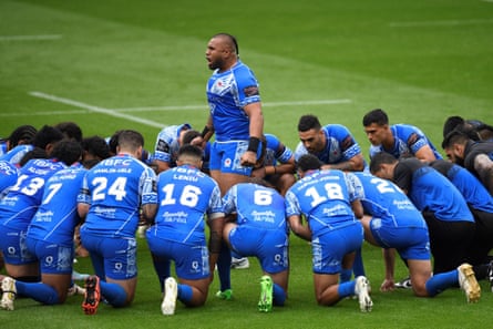 Samoan players perform the haka before their match against England.