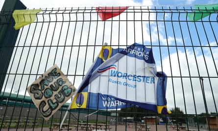 Flags and posters with the phrase ‘Save our club’ on the gates outside Worcester’s stadium.