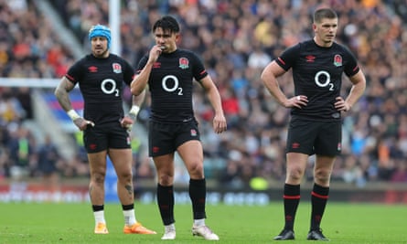Jack Nowell, Marcus Smith and Owen Farrell show their disappointment after England's defeat by Argentina