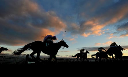 Runners and riders in action as they compete in the Valda Energy Novice Handicap Hurdle at Cheltenham on Friday.