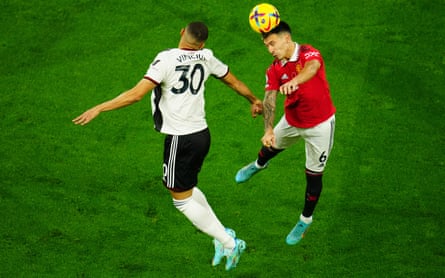 Lisandro Martínez (right) heads a ball against Fulham