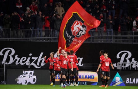 Rennes players celebrate as they beat PSG