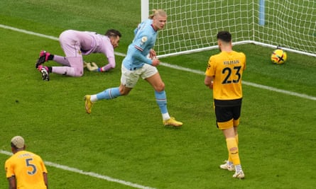Erling Haaland of Manchester City runs off to celebrate after scoring the first of his three goals against Wolves.