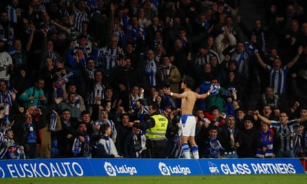 Takefusa Kubo whips off his shirt after netting the second goal of the game