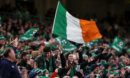Ireland fans celebrate Dan Sheehan scoring their third try against England