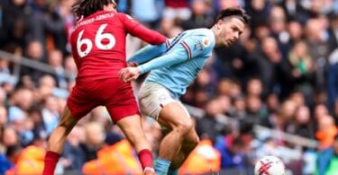 Jack Grealish spins away from Trent Alexander-Arnold